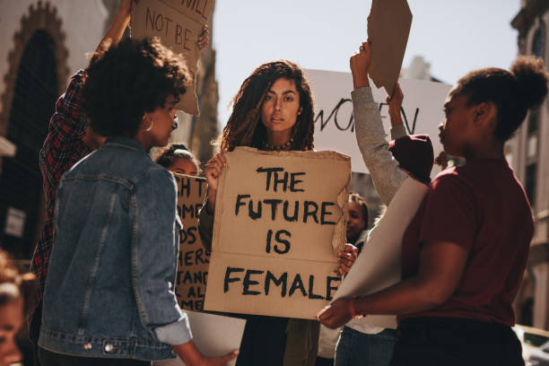 istock Group of women protesting outdoors 973274956