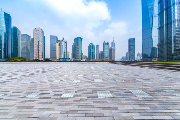 istock Panoramic skyline and modern business office buildings with empty road,empty concrete square floor 973275018
