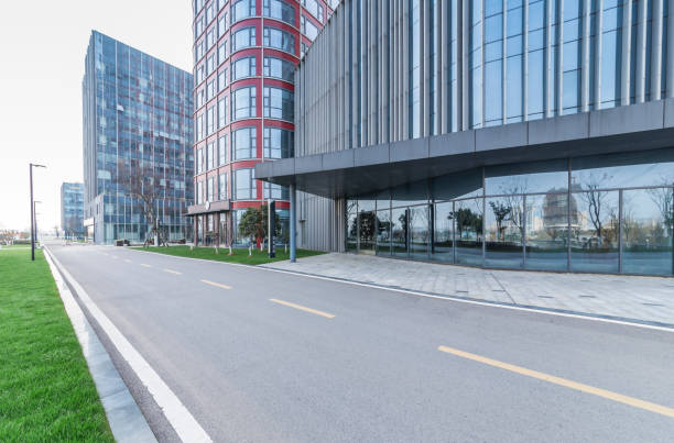 istock Panoramic skyline and modern business office buildings with empty road,empty concrete square floor 973275332