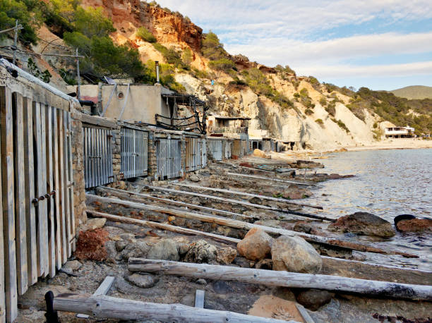 istock Cala d'Hort beach and boat garages 973275386