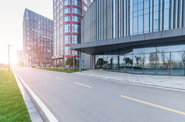 istock Panoramic skyline and modern business office buildings with empty road,empty concrete square floor 973275456