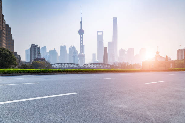 istock Panoramic skyline and modern business office buildings with empty road,empty concrete square floor 973275550