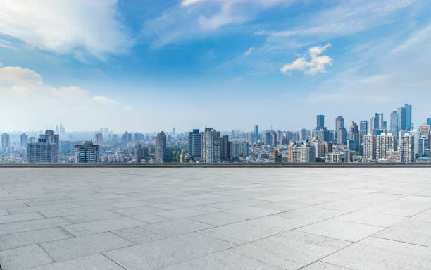 istock Panoramic skyline and modern business office buildings with empty road,empty concrete square floor 973278630