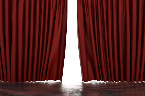 Theater red curtain open with spot lighting