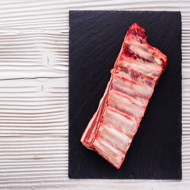 istock fresh lamb meat on a textured stone plate 973280272