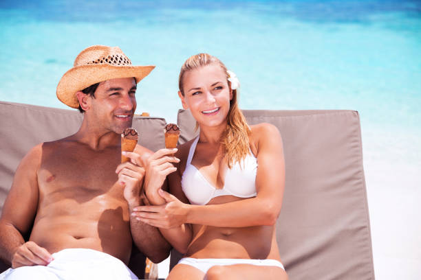 istock Happy couple on the beach 973280408