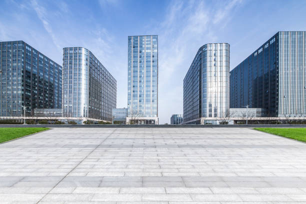 istock Panoramic skyline and modern business office buildings with empty road,empty concrete square floor 973280640