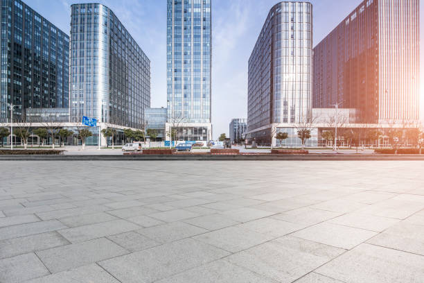 istock Panoramic skyline and modern business office buildings with empty road,empty concrete square floor 973282878