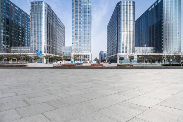 istock Panoramic skyline and modern business office buildings with empty road,empty concrete square floor 973282952