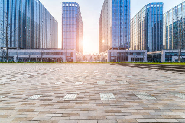 istock Panoramic skyline and modern business office buildings with empty road,empty concrete square floor 973283956