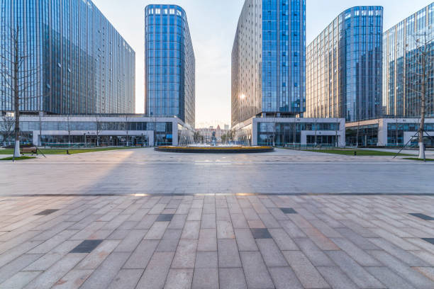 istock Panoramic skyline and modern business office buildings with empty road,empty concrete square floor 973284068
