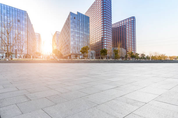 istock Panoramic skyline and modern business office buildings with empty road,empty concrete square floor 973284070