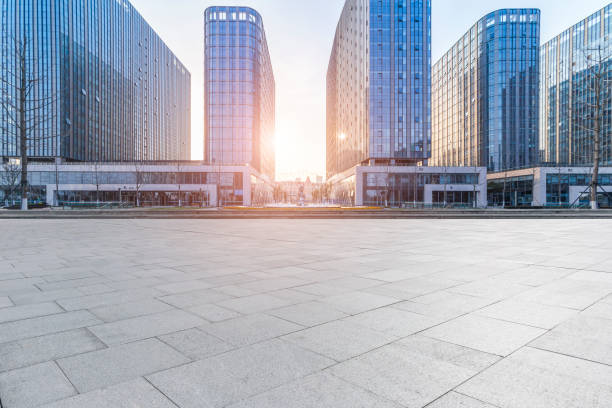 istock Panoramic skyline and modern business office buildings with empty road,empty concrete square floor 973284108