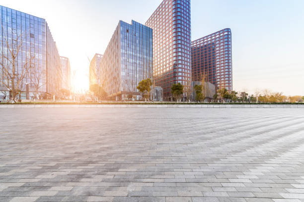 istock Panoramic skyline and modern business office buildings with empty road,empty concrete square floor 973284488