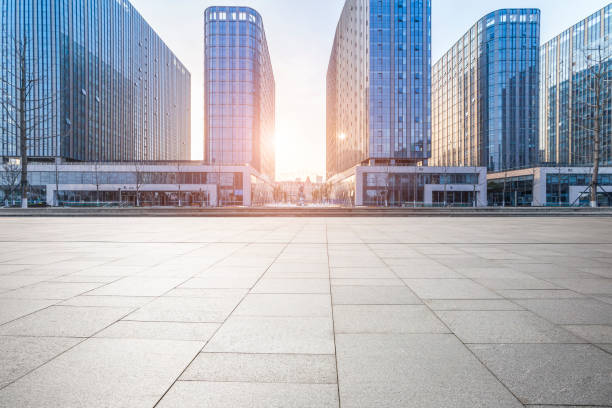 istock Panoramic skyline and modern business office buildings with empty road,empty concrete square floor 973284492