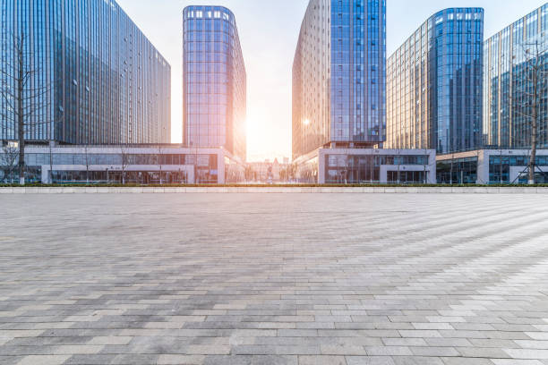 istock Panoramic skyline and modern business office buildings with empty road,empty concrete square floor 973284498