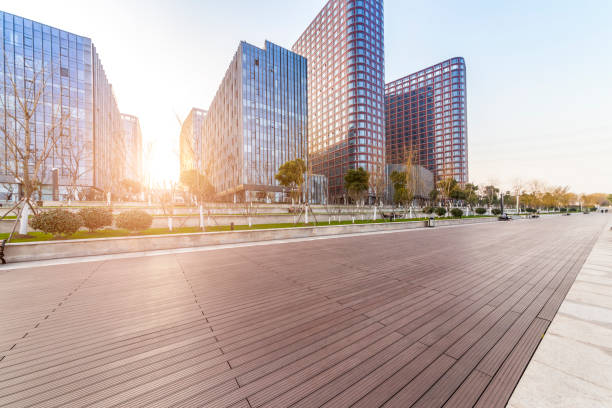 istock Panoramic skyline and modern business office buildings with empty road,empty concrete square floor 973284988