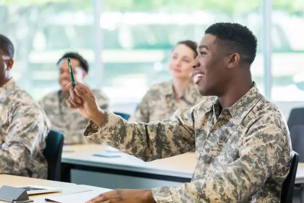 Photo of Cadet asks question during class