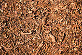 Brown, natural mulch texture with a warm atmosphere