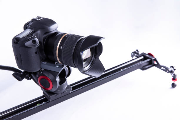 camera on a video slider on a white background. isolated