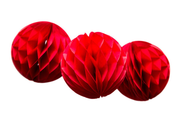 istock Red honeycomb  paper balls decoration isolated on white background 973293876