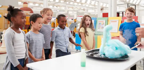 Photo of Kids having fun watching an experiment at a science centre