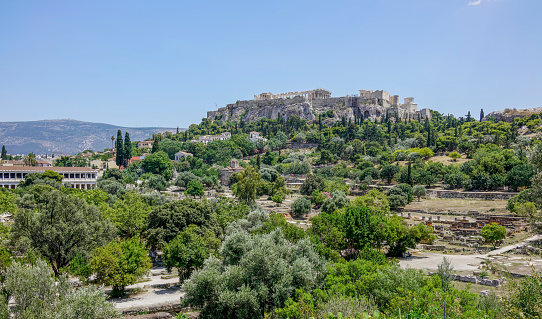 View of the ancient Agora of Athens, Greece with the Acropolis in the background.