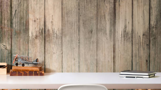 istock Loft workspace desk with books, house plant and copy space 973296814