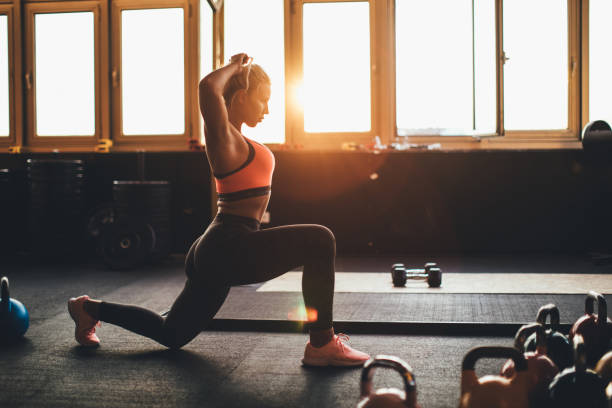 istock Beautiful blonde exercising in gym 973297362