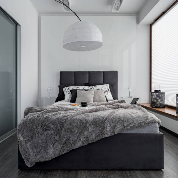 istock Bedroom with modern lamp 973300680