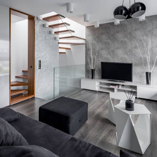 istock Living room with staircase 973300684
