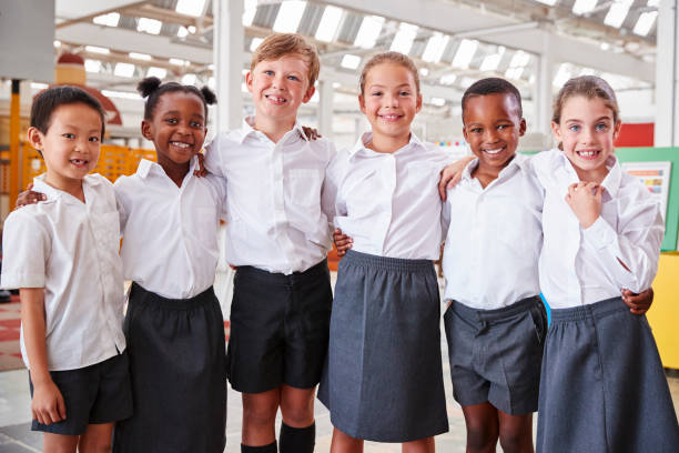 istock Classmates posing for photo at a science centre 973300792