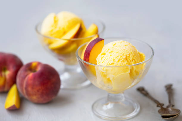 Peach icecream in cups, summer refreshing tasty dessert