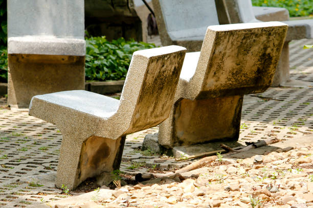 Concrete seat with polished pebble grain surface in public park, Bangkok, Thailand