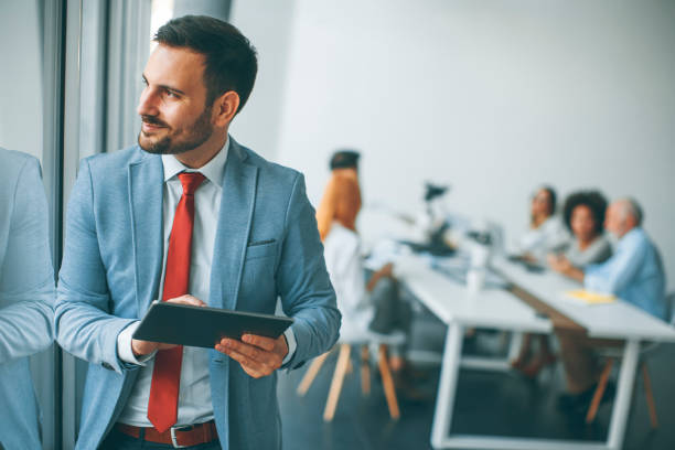 istock Young businessman with digital tablet in office 973301410