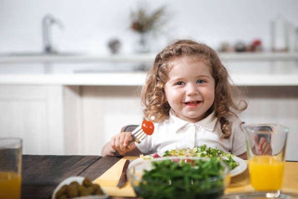 istock Excited child enjoying healthy breakfast at home 973305688