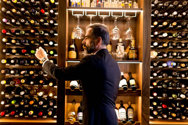 istock Man chooses a bottle of wine 973310448