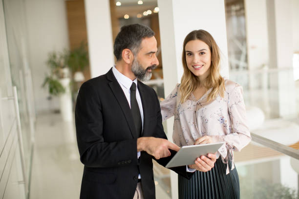 istock Business couple with digital tablet in office 973310672