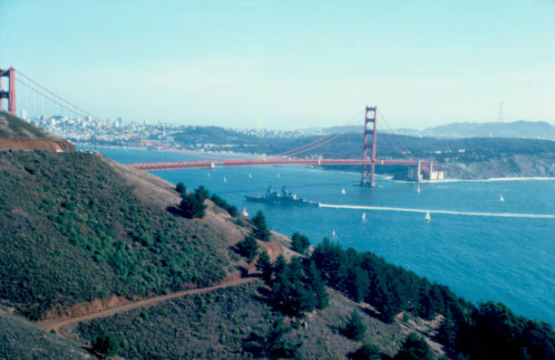istock Navy Ship passing under the Golden Gate Bridge 973314006