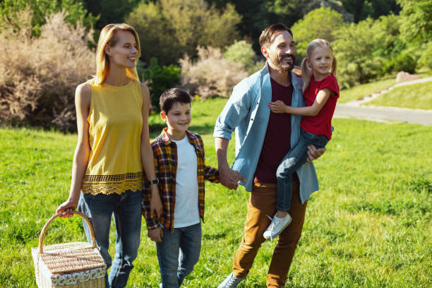 istock Content family having a walk in the park 973318336