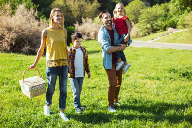 istock Happy parents walking with their kids 973318456