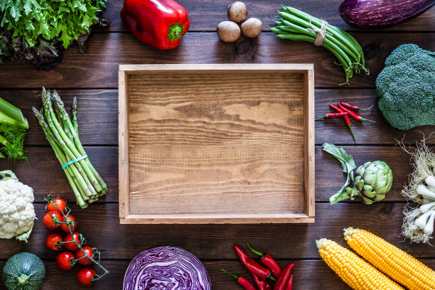 istock Empty wooden crate and vegetables 973318648