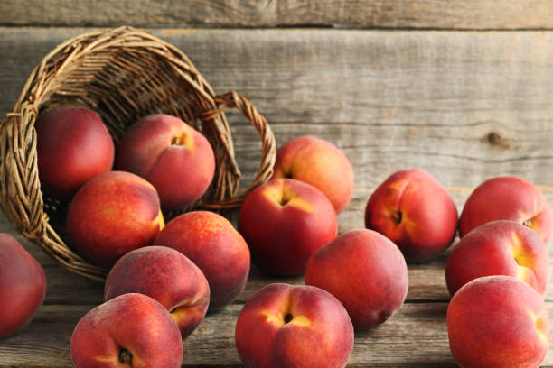 istock Sweet nectarines fruit on grey wooden table 973319184