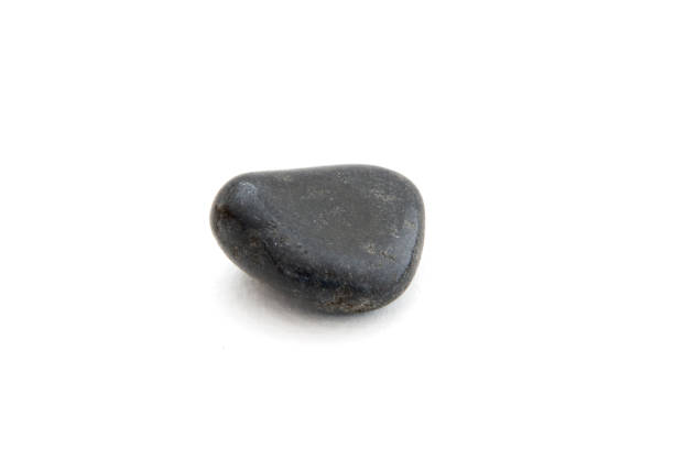 istock Black tourmaline mineral on the white background 973321510