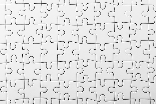 White jigsaw puzzle pattern as a background