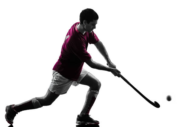 istock field hockey player man isolated silhouette white background 973322726