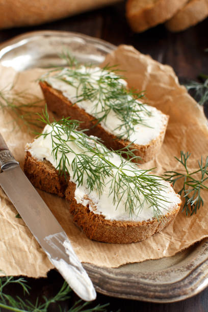 istock Sandwiches with cream cheese and fresh dill 973324934