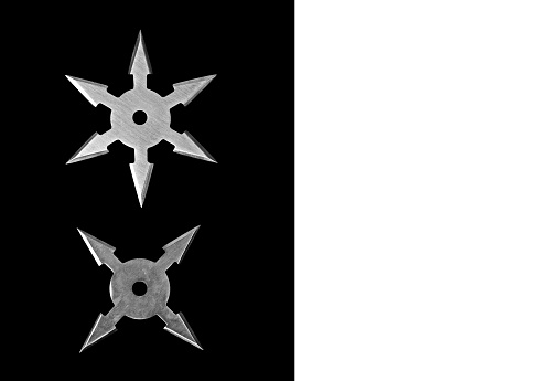 Closeup Ninja Star Shurikens on Black Background with Space for Text, Clipping Path