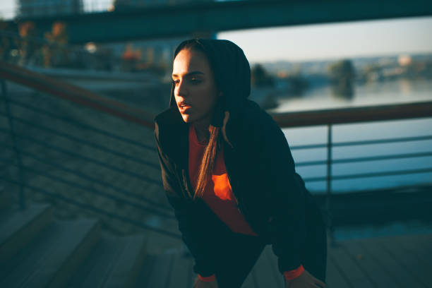 istock Young woman exercising outside 973330010