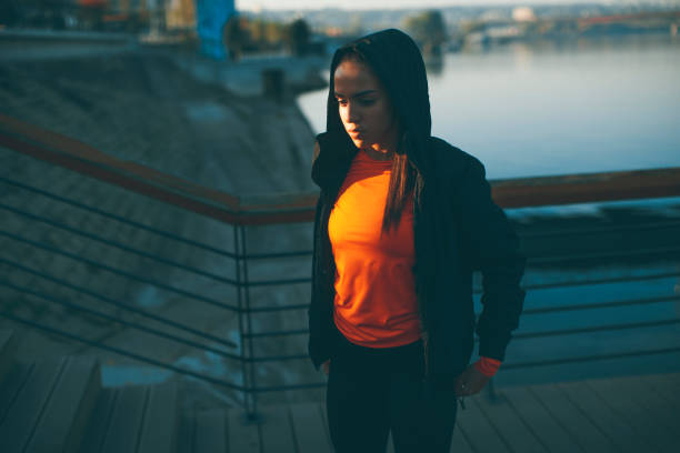 istock Young woman exercising outside 973330024
